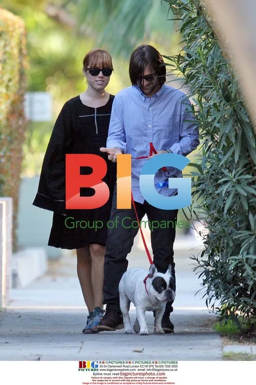 Jason Schwartzman and Brady Cunningham walk bulldog