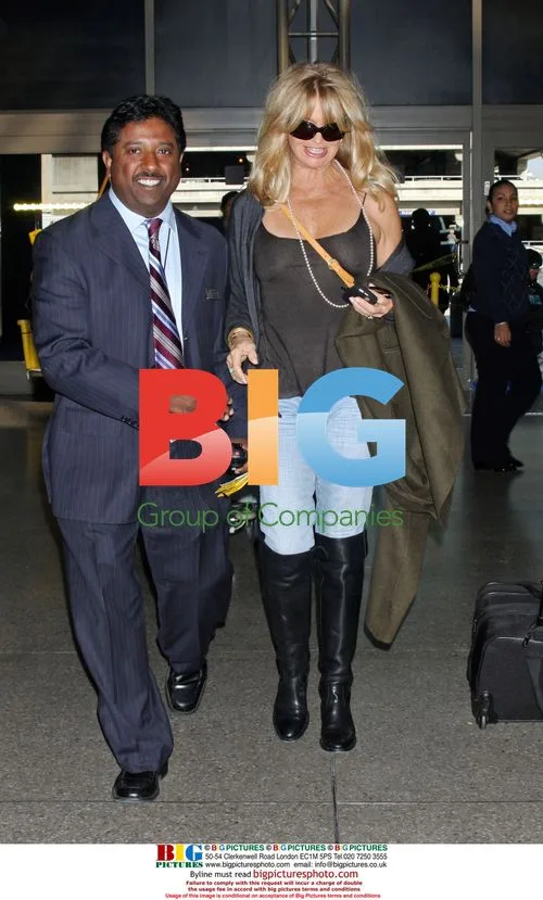 Goldie Hawn Departs LAX with Mystery Man