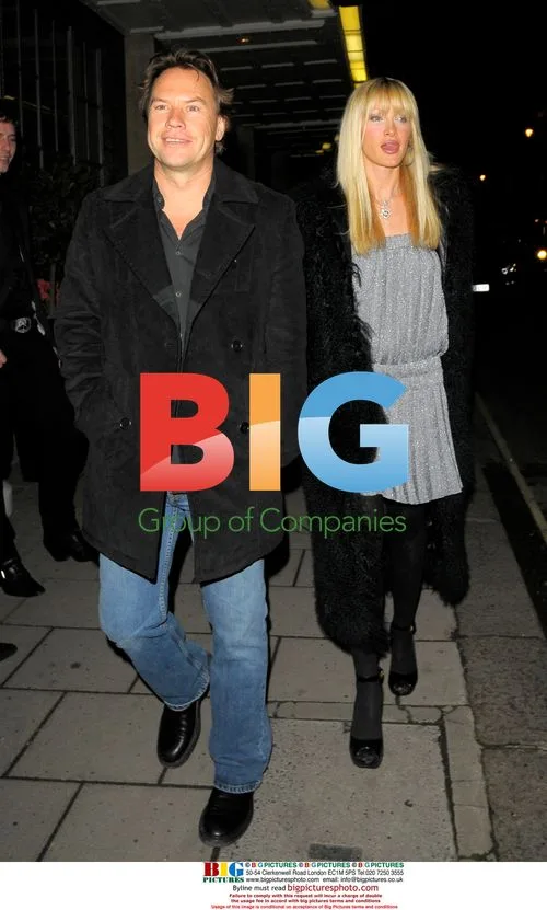 Caprice and mystery man leaving Claridges
