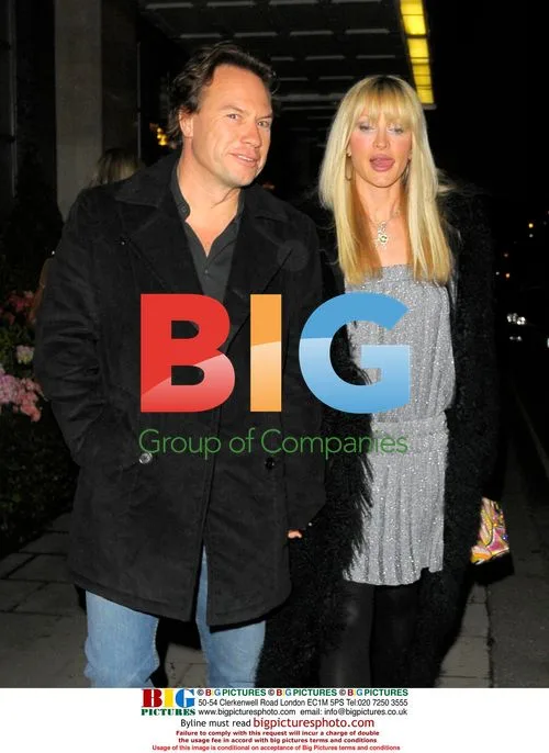 Caprice and mystery man leaving Claridges