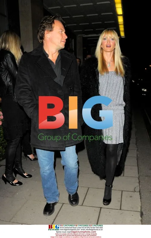 Caprice and mystery man leaving Claridges