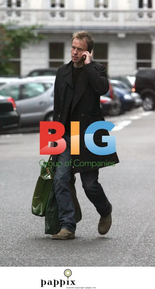 TV presenter Tim Lovejoy on mobile phone