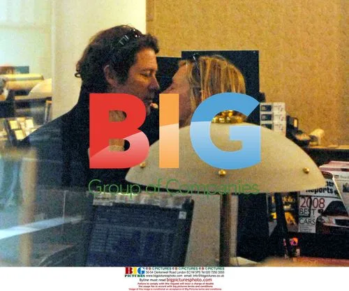 Uma Thurman and Arpad Busson Kissing