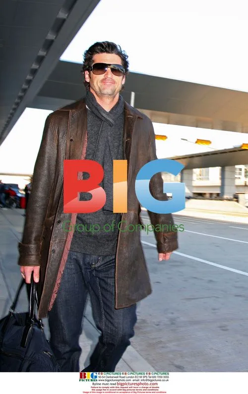 Patrick Dempsey and wife exit JFK