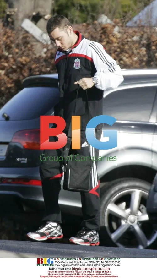 Liverpool's Dirk Kuyt arrives in new Audi R8