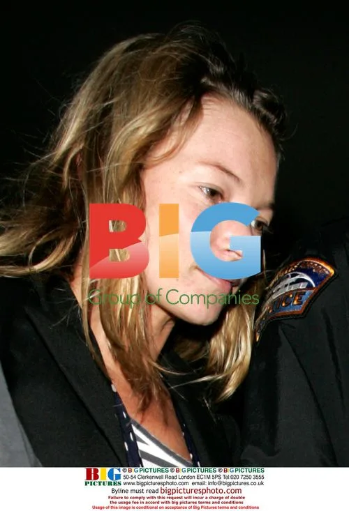 Kate Moss Swarmed by Paparazzi at LAX
