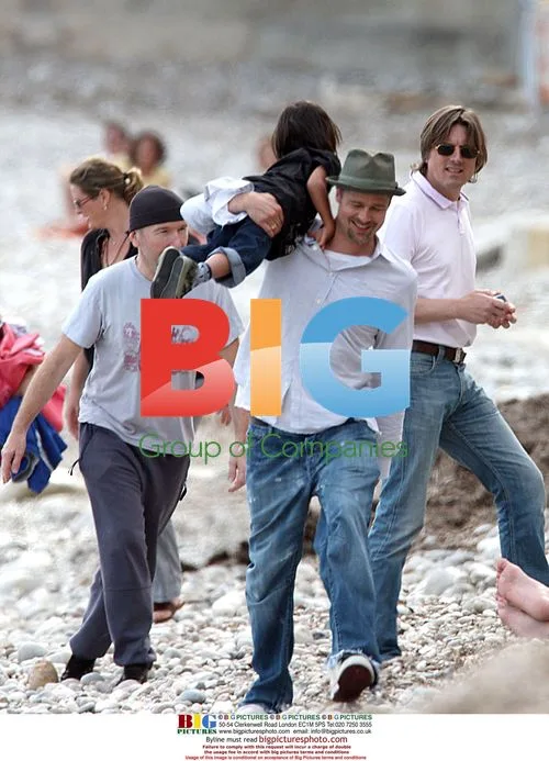 Angelina Jolie and Brad Pitt on family beach walk