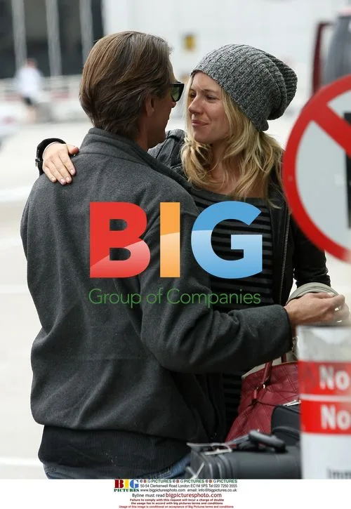 Sienna Miller hugs mystery man at LAX