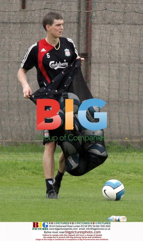 Liverpool's Daniel Agger as ball boy at training
