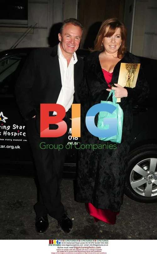 Bobby Davro and friend leaving Dorchester