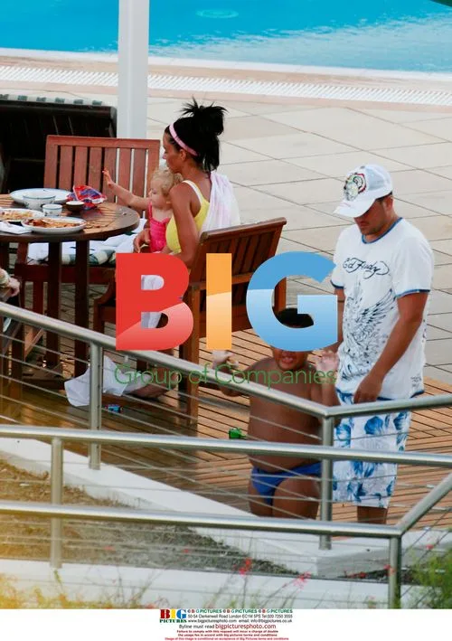 Katie Price with family at hotel pool