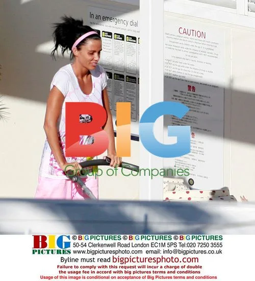 Katie Price with family at hotel pool