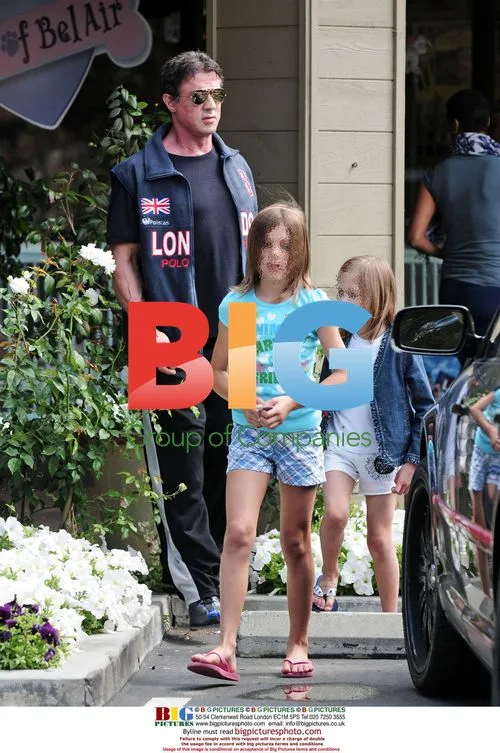 Sylvester Stallone shops with daughters