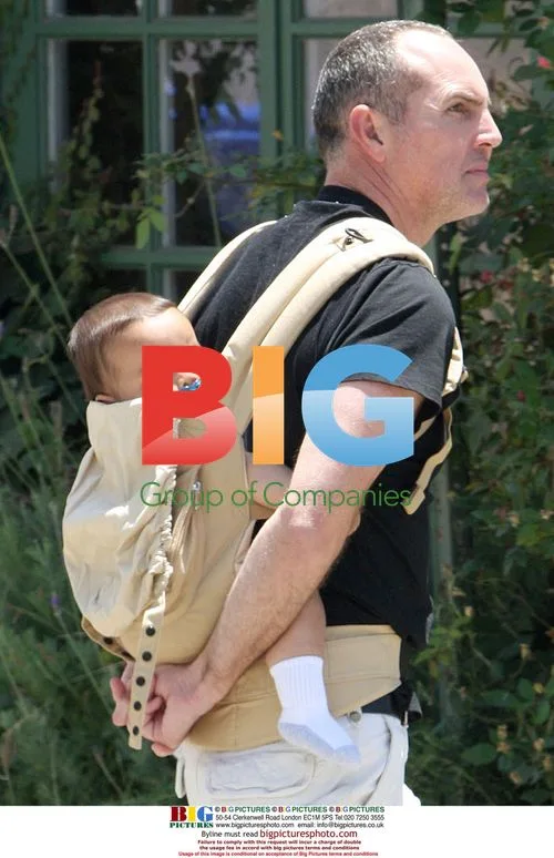 Arnold Vosloo out with baby in backpack