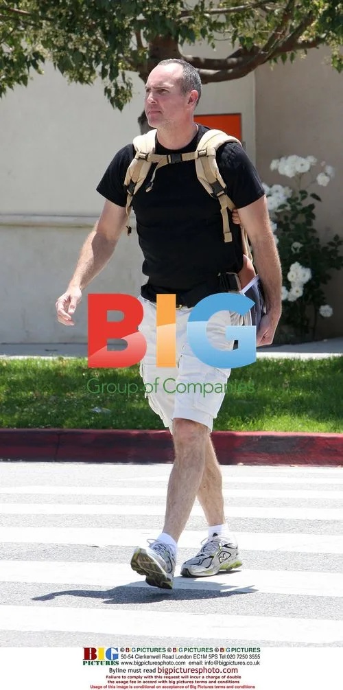 Arnold Vosloo with newborn in backpack
