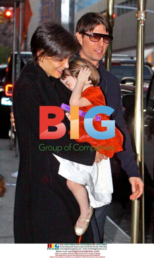 Tom Cruise, Katie Holmes, and daughter Suri exit NYC apartment