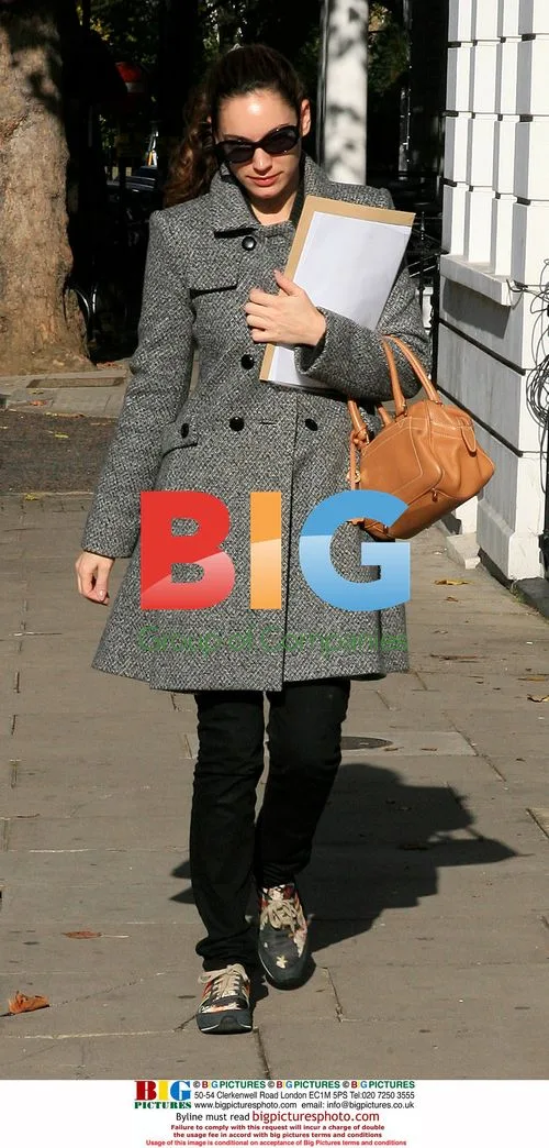 Kelly Brook leaves house in colorful trainers