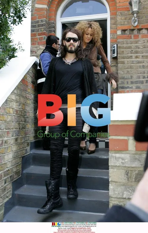 Russell Brand leaves home with girlfriend