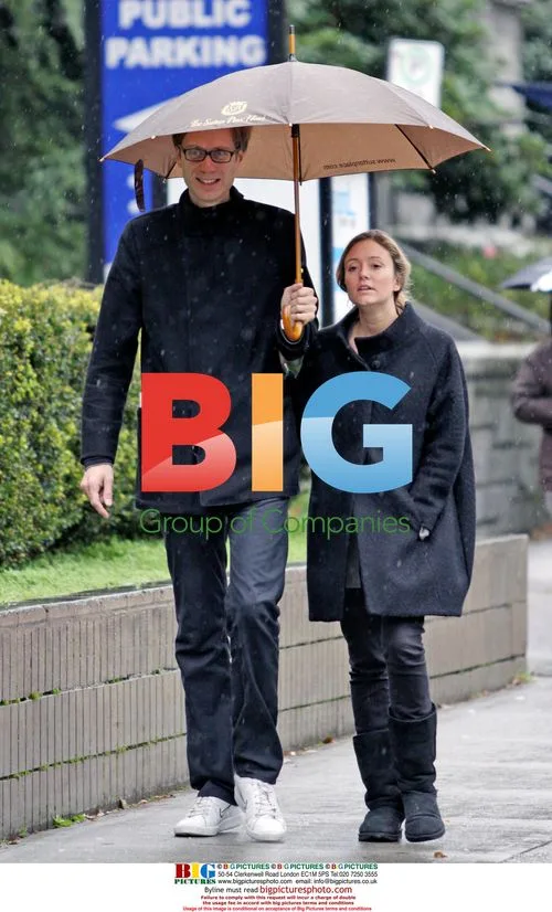 Stephen Merchant and girlfriend in the rain