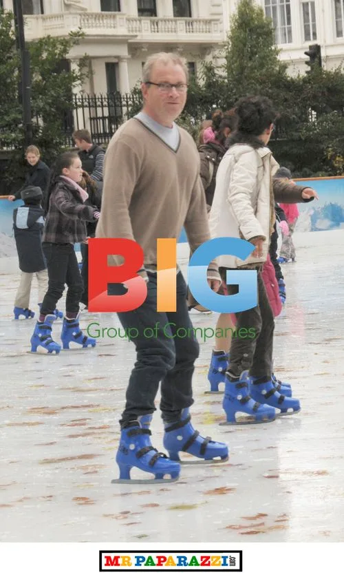 Harry Enfield and daughter ice skating