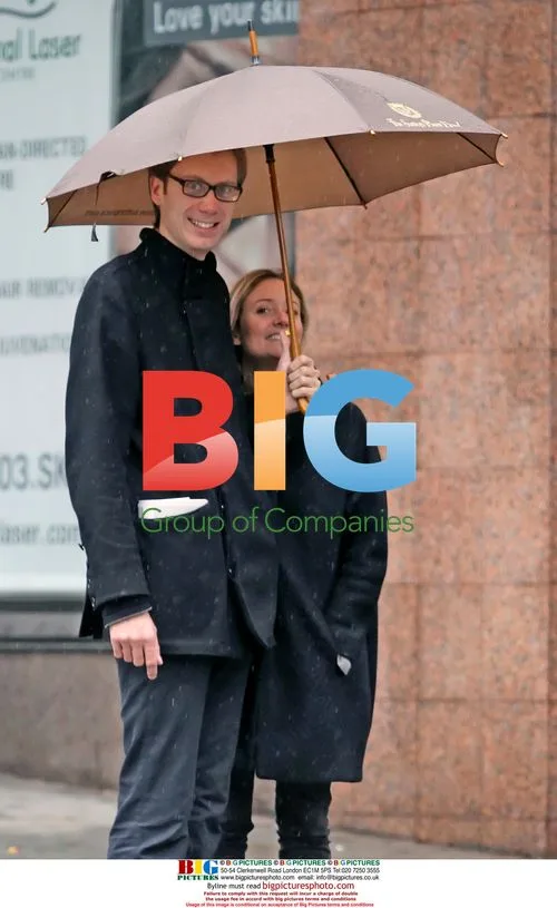 Stephen Merchant walks in Vancouver rain