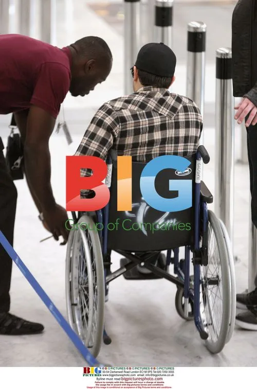 Jesse Metcalfe in wheelchair at airport