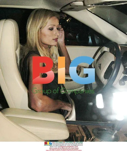 Paris Hilton exits restaurant after split