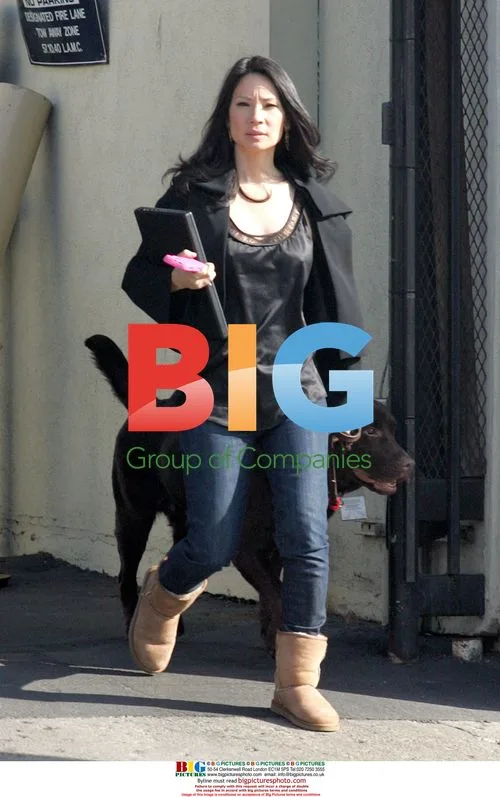Lucy Liu walks dog on set