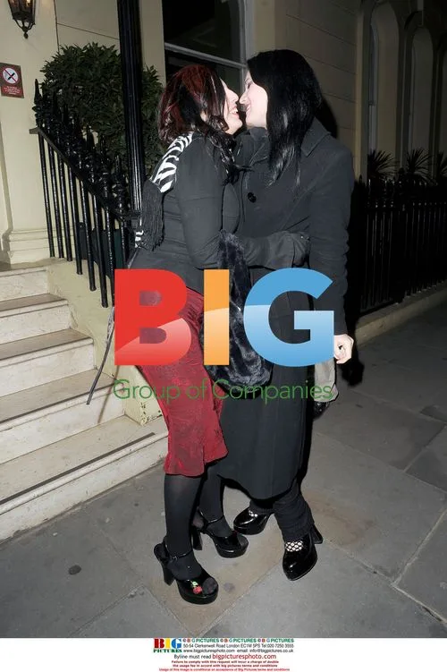 Georgina Baillie shares passionate kiss with bandmate