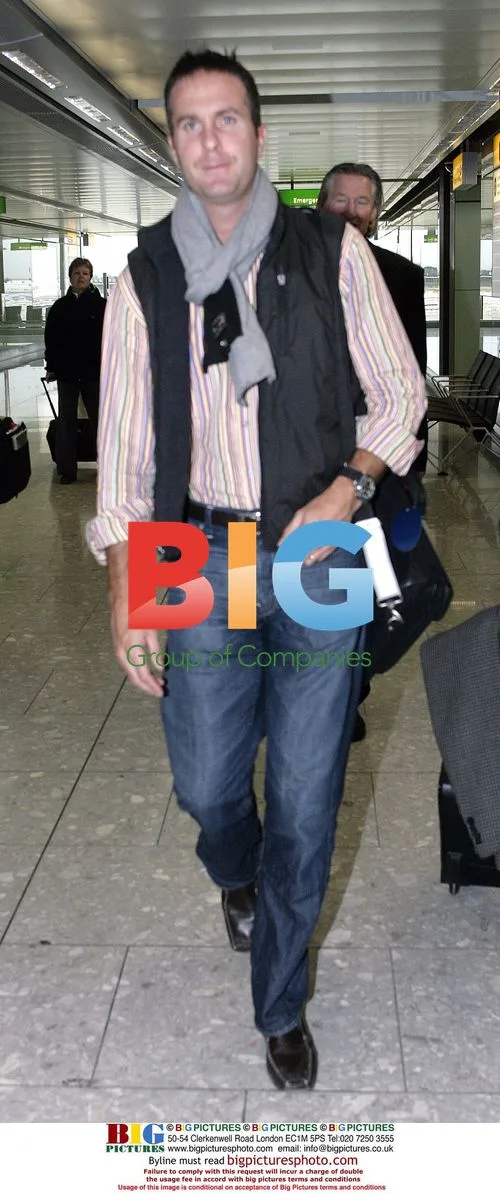 Michael Vaughan returns home from India