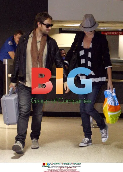 Charlize Theron and Stuart Townsend Arrive at LAX