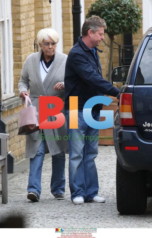 Wendy Richards departs home with partner