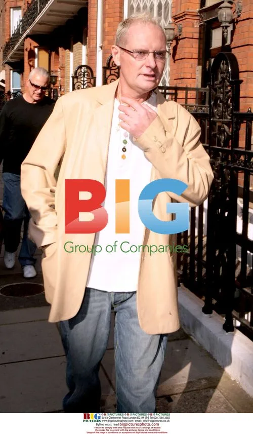 Paul Gascoigne seen with friend and bag