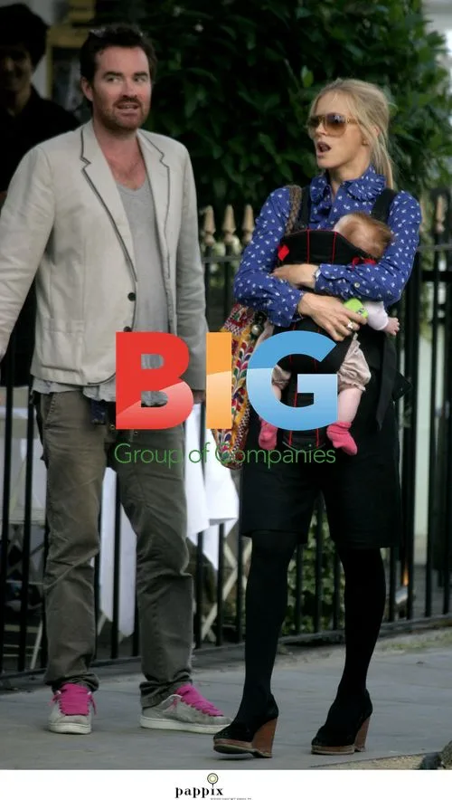 Laura Bailey with partner Eric Fellner and baby