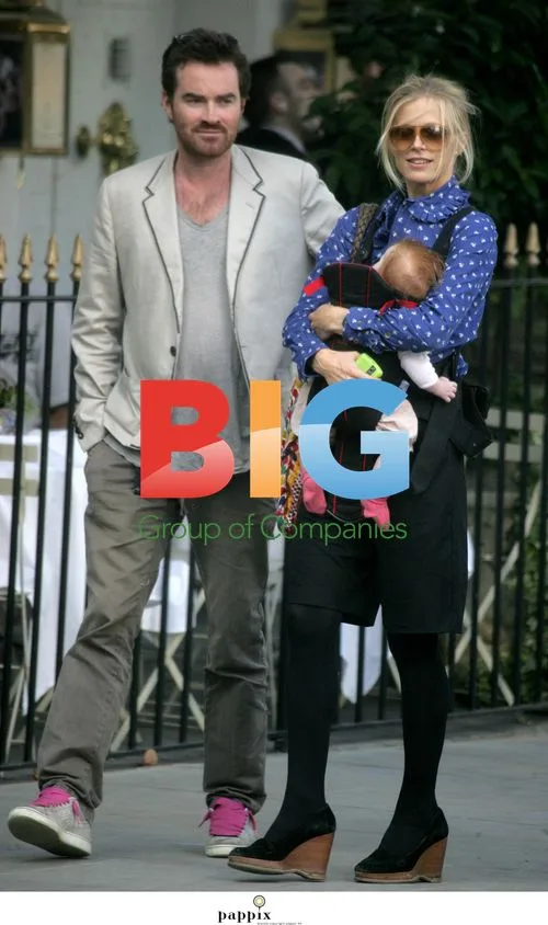 Laura Bailey & Eric Fellner with baby in London