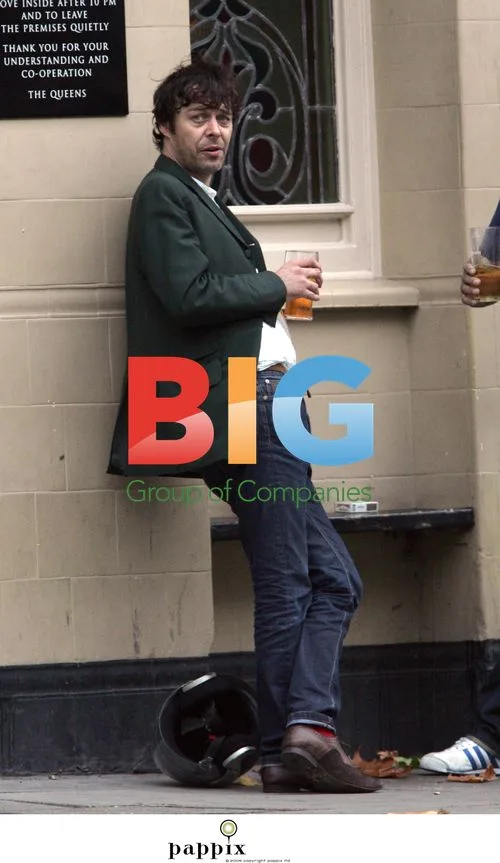 Mick Whitnall Enjoying Pint at Local Pub