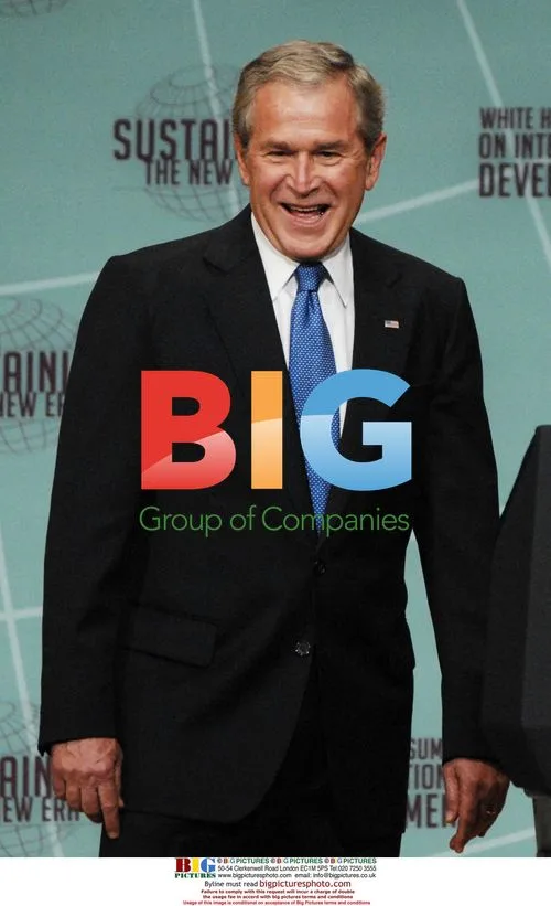 Bush laughs with Liberian President at summit