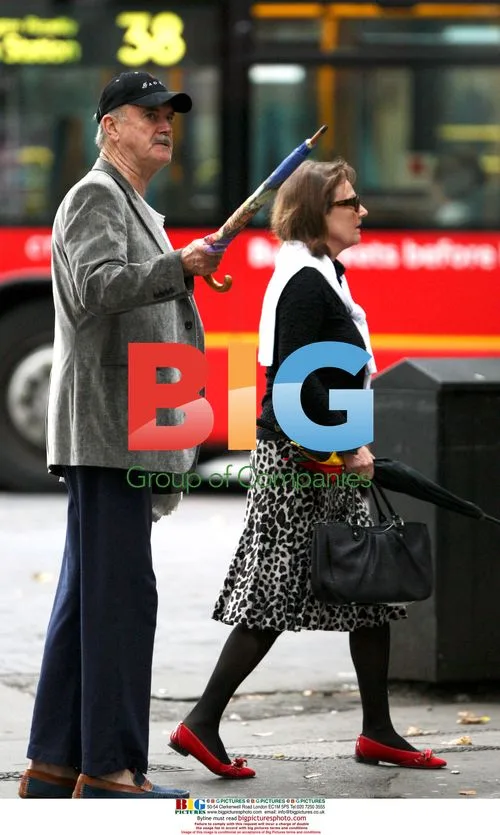 John Cleese with umbrella in London