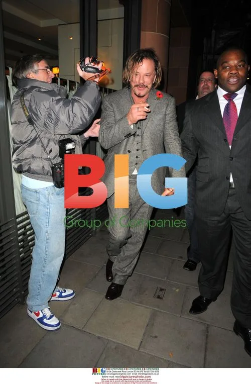 Mickey Rourke gets help from security guard in London
