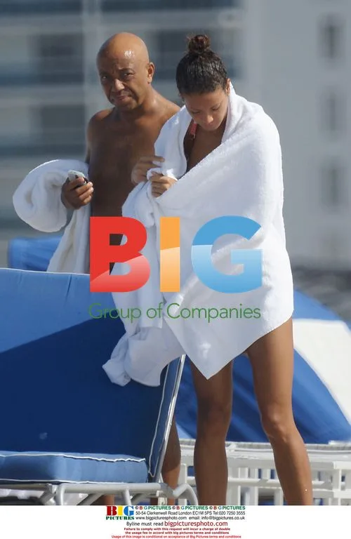 Russell Simon and wife on beach in Miami