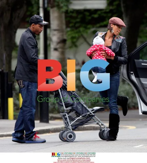 Singer Javine Hylton with MC Harvey and baby