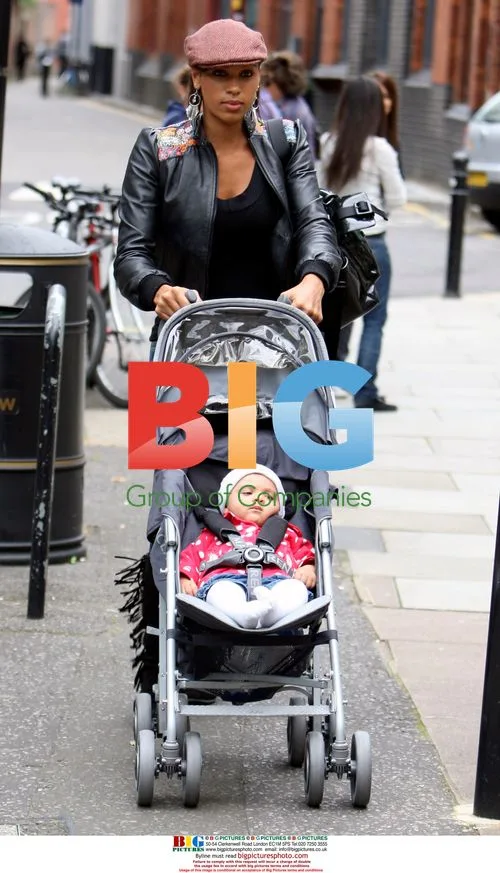 Javine Hylton out with fiance MC Harvey and baby