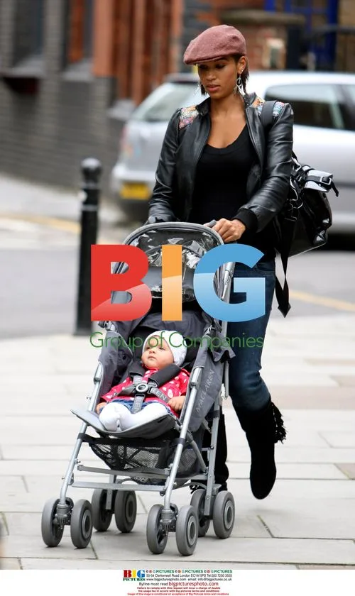Singer Javine Hylton with MC Harvey and baby