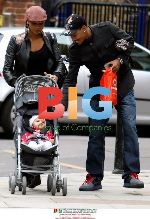 Javine Hylton with MC Harvey and baby