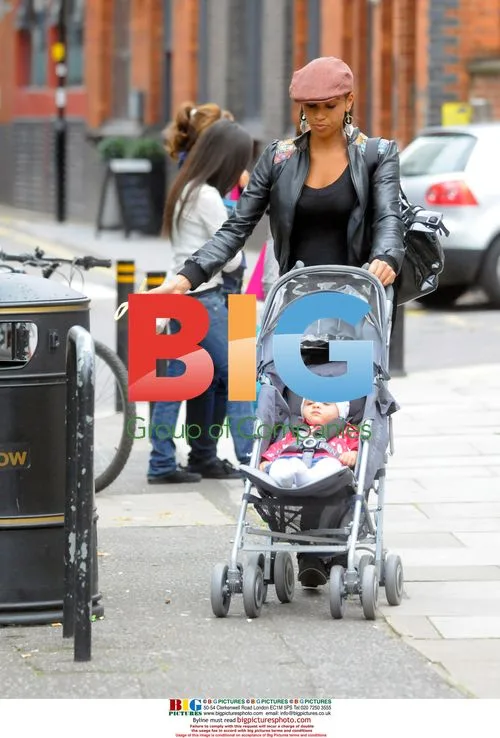 Javine Hylton with MC Harvey and baby in London