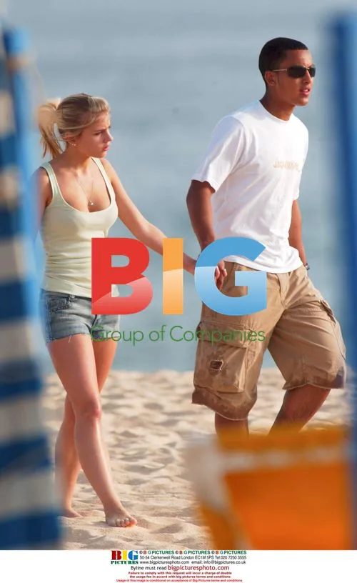 Theo Walcott and Melanie Slade on the Beach