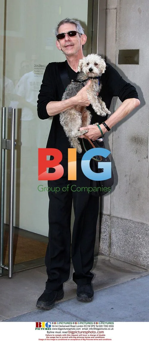Richard Belzer with dog on Madison Ave