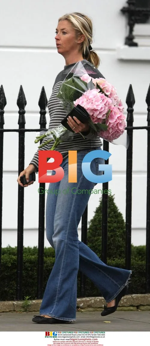 Tamara Beckworth chats on phone with flowers