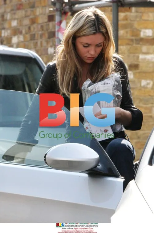 Abigail Clancy Seen with Police Letter