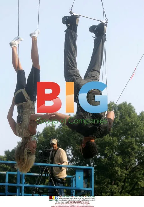 Kelly Ripa and David Blaine hang upside down